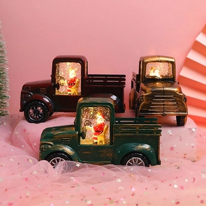 Vintage light-up Santa Claus tractor water globe decoration with glitter and warm glow
