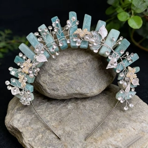 Macro detail of crown headband with natural rose quartz stones and pearl leaf accents