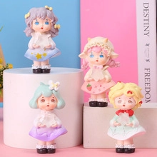 Group of colorful resin cartoon figures on geometric bases for office desk decor