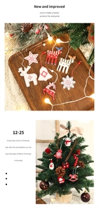 Detailed view of Christmas wooden and felt ornaments hanging on a mini festive tree