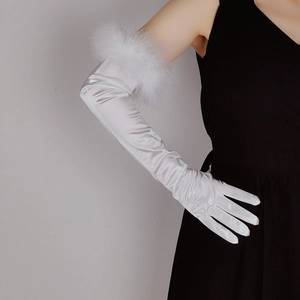 Close-up of white satin long gloves featuring elegant feather trim detailing on the cuffs