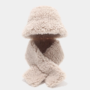 Detailed texture of thick cream-colored fleece winter bucket hat and scarf set