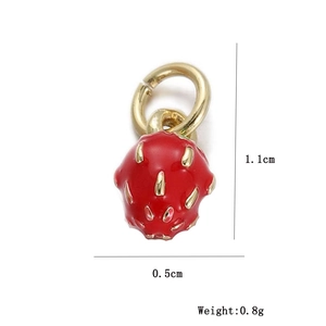 Macro shot of 1.1cm x 0.5cm strawberry charm with red enamel finish and gold details