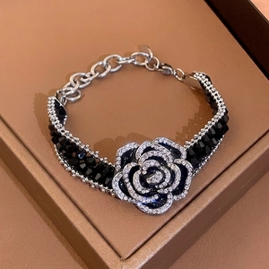 French camellia crystal bracelet with black beads and sparkling diamonds in silver