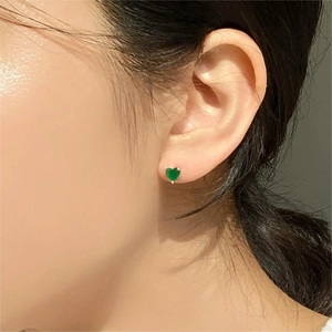 Elegant 925 sterling silver heart-shaped green zircon stud earrings on model