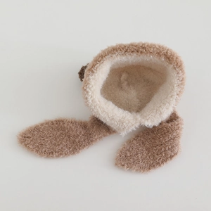 Close-up of soft plush brown bear ear hat with thick faux fur lining and texture
