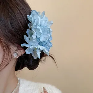 Elegant light blue fabric flower hair pin for women with layered tulle petals