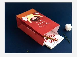 Red teacher gift bag with cartoon illustration and 'You're my favourite teacher' text