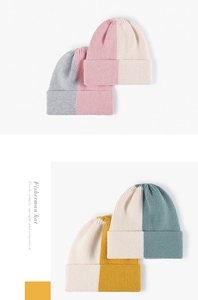 Detailed knit rib texture and rolled cuff of the two-tone color block fisherman beanie