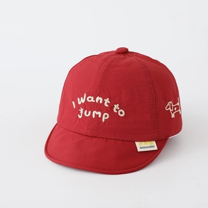 Detail of red baby sun hat with white 3D embroidery and side puppy pattern decor