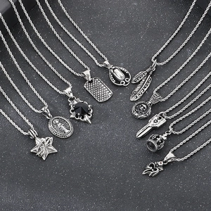 Vintage silver punk pendants set with black zircon stars and feathers on steel twist chains