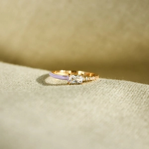 Macro shot of s925 silver ring featuring rectangle zircon and purple enamel detail