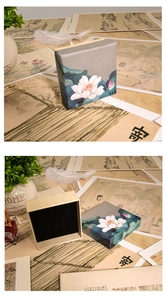 Detailed view of Chinese style square jewelry box with lotus print and black velvet interior