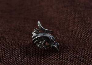 Macro detail of vintage S925 sterling silver lizard ring with textured punk finish