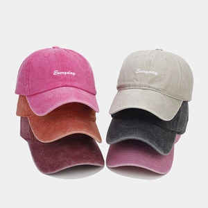 Detail showing multi-color washed cotton baseball caps with Everyday embroidery detail