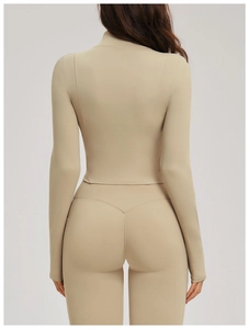Slim fit yoga jacket back view showing high-stretch fabric and contouring seams