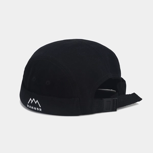 Detail of adjustable strap and mountain logo embroidery on black cotton Miki hat