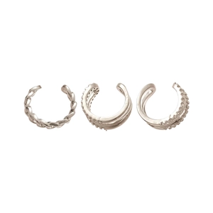 Three-piece silver ear cuff set with twisted, layered, and beaded minimalist metal designs