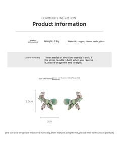 Detail view of mint green butterfly earrings with silver pins and size measurements