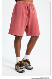 Detail of retro washed brick red cotton sweat shorts with adjustable drawstring waist