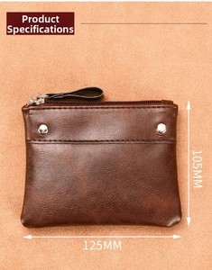 Detail view of dark brown pebbled leather coin purse with zipper and silver rivets