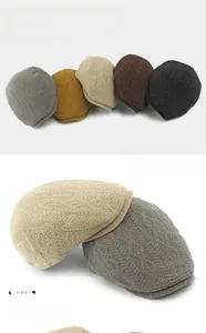Detail of knitted beret hats showing diamond patterns in five different classic colors
