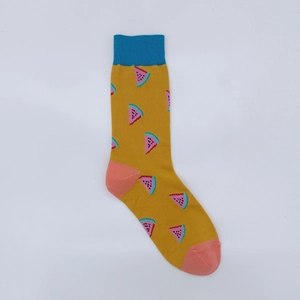 Detailed view of yellow cotton socks with colorful watermelon patterns and blue cuffs