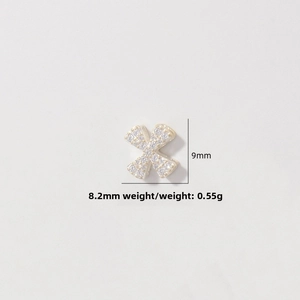 Macro detail of X-shaped S925 silver pendant with pave zircons, size 9mm x 8.2mm