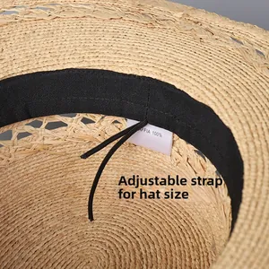 Detail of 100% raffia straw hat interior with adjustable inner strap and sweatband