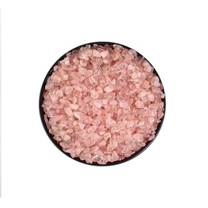 Natural pink quartz crystal raw stones in a black bowl for aromatherapy and healing