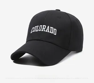 Side view of black baseball cap featuring white Colorado letter embroidery and curved brim