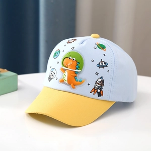 Detail view of cartoon dinosaur astronaut embroidery on blue and yellow kids baseball cap