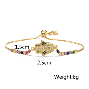 Detail view of 18K gold plated Hamsa Hand bracelet with colorful zircons and size markings