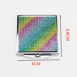 Detail view of a square folding mirror with rainbow rhinestones and 6.8x6cm dimensions