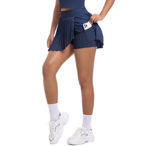 Detail view of navy blue pleated tennis skirt with high waist and functional side phone pocket