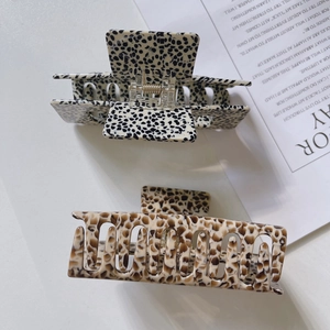 Large acetate hair claws in leopard print and dalmatian pattern for long hair styling