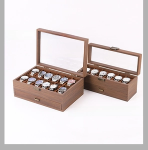 Detail view of wooden watch organizer with glass lid and retro metal lock