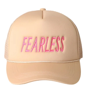 Close-up of beige trucker hat featuring pink Fearless embroidery and rope detail