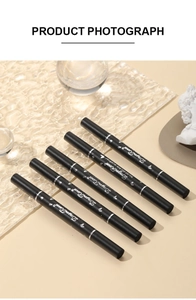 Close-up of dual-ended liquid eyeliners on textured glass with minimalist props