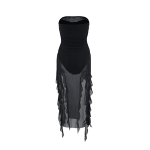 Detail of the sheer mesh fabric and ruffled wavy edges on the black tube dress