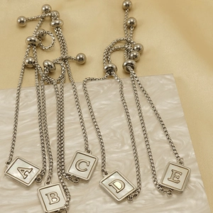 Adjustable silver titanium steel bracelet with square shell alphabet charms A-E
