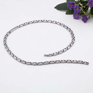 Detail of silver stainless steel chain with H-shaped links and industrial clasp design