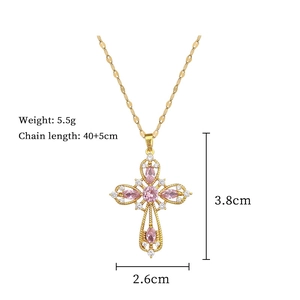 Detail showing cross pendant dimensions with pink stones and gold chain measurements