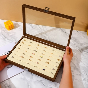Walnut wood jewelry box with glass lid and velvet slots for rings and necklaces