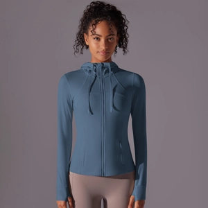 Women's slim fit hooded sports jacket in blue with zipper pockets and thumb holes