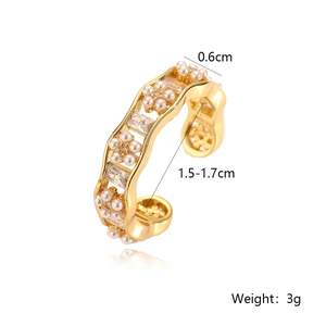 Detailed view of gold plated ring with pearl and zircon showing 0.6cm width measurements