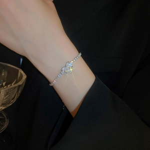 Detailed view of silver luxury heart bracelet with sparkling zircon crystals on wrist