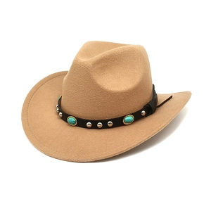 Detail of camel wool fedora hat featuring black leather band with turquoise and silver studs
