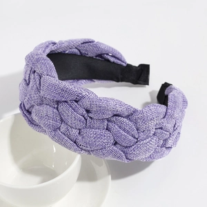 Detailed view of purple woven fabric headband with thick linen texture and wide design