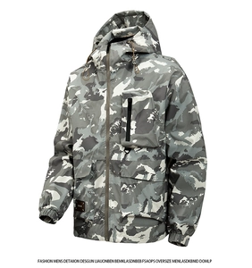 Detail of grey camouflage jacket featuring a zipped chest pocket and flap pockets